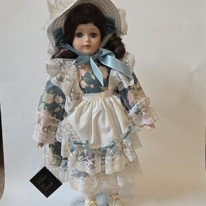Elegant Blue and White Porcelain Doll with Stand